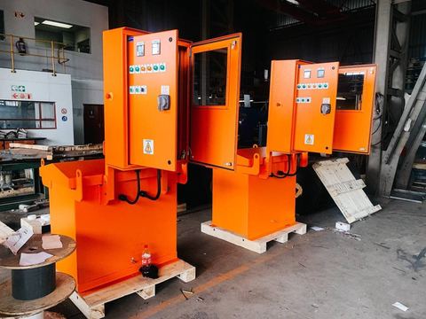 Orange magnet panels on stands in a workshop